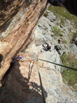 Looking down at the belay from pitch 3